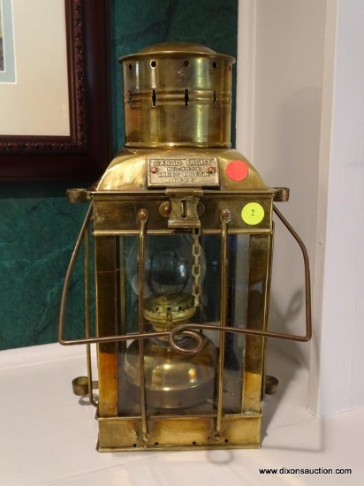 (LR) VINTAGE BRASS CARGO LAMP FROM GREAT BRITAIN (1939). MEASURES 6 IN X 6 IN X 17 IN. ITEM IS SOLD