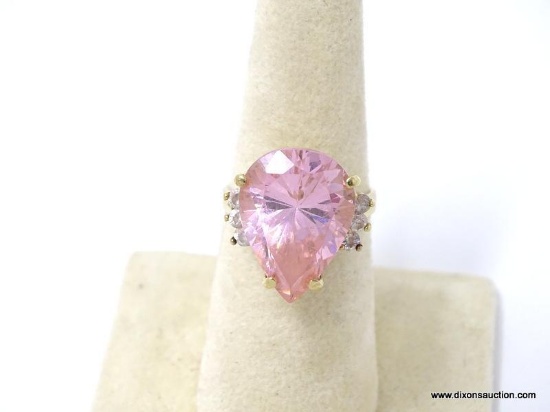 10K YELLOW GOLD RING WITH LARGE PEAR SHAPED PINK TOPAZ ACCOMPANIED BY (3) SM. ROUND CUT DIAMONDS ON