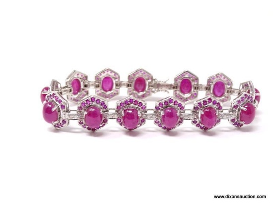 FANCY 14K WHITE GOLD, RUBY & DIAMOND BRACELET. (13) CABOCHON CUT RUBIES. EACH ONE IS ACCOMPANIED