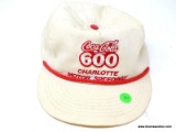 COCA-COLA 600 CHARLOTTE MOTOR SPEEDWAY WHITE WITH RED ROPE TRIM ON THE LID OF THE HAT, INCLUDES