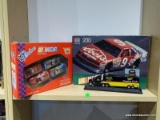 ASSORTED LOT TO INCLUDE A BILL ELLIOTT 200 PIECE PUZZLE, A 1:64 SCALE TEAM TRANSPORTER FOR MILLER