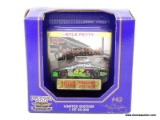 RACING CHAMPIONS 1:64 SCALE DIECAST CAR OF THE #42 DRIVEN BY KYLE PETTY. IS 1 OF 20,000. IS IN