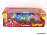 RACING CHAMPIONS 1/24 SCALE DIECAST STOCK CAR REPLICA, #24 DRIVEN BY JEFF GORDON, IS IN PACKAGE.