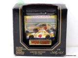 RACING CHAMPIONS 1:64 SCALE DIECAST CAR IN PACKAGE WITH COLLECTIBLE CARD OF THE #4 CAR DRIVEN BY
