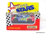 MATCHBOX 1995 SUPERSTARS #24 DUPONT RACING CAR DRIVEN BY JEFF GORDON. IS IN PACKAGE. ITEM IS SOLD AS