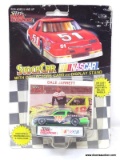 RACING CHAMPIONS 1:64 SCALE STOCK CAR OF THE #18 CAR DRIVEN BY DALE JARRETT. IS IN BLISTER PACKAGE.