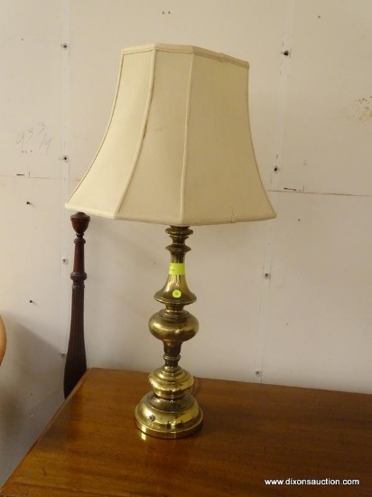 (R1) BRASS TABLE LAMP WITH RECTANGULAR CLOTH SHADE AND BRASS FINIAL. MEASURES 33 IN TALL. ITEM IS
