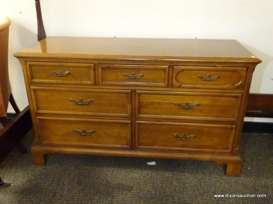 (R1) DAVIS CABINET CO. 7 DRAWER MAHOGANY DRESSER WITH CHIPPENDALE PULLS. MEASURES 54.5 IN X 20.5 IN