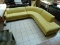 YELLOW UPHOLSTERED CORNER SECTIONAL SOFA WITH BUTTON TUFTED SEATS. MEASURES APPROXIMATELY 106 IN X