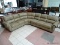 BRAND NEW TOP GRAIN LEATHER TAUPE 3 PIECE SECTIONAL BY ABBYSON. HAS BRASS STUDDED ACCENTS ALONG THE