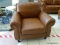 BRAND NEW ABBYSON TOP GRAIN LEATHER ARMCHAIR WITH BRASS STUDDED ACCENTS AND ROLLED ARMS. MEASURES 40