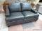 BRAND NEW MERONA LEATHER LOVESEAT IN GRAY. INTRODUCE SLEEK MID-CENTURY STYLE TO YOUR LIVING SPACE