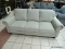 BRAND NEW GRAY DEANA FABRIC SOFA. THE DEANA FABRIC SOFA WAS MASTER-BUILT WITH COMFORT IN MIND.