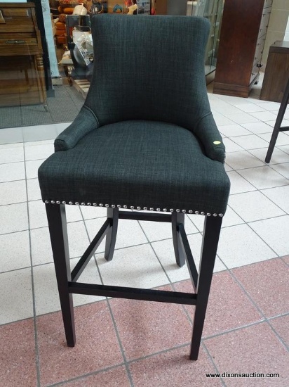 BRAND NEW GRAY UPHOLSTERED BAR CHAIR WITH SILVER TONE STUDDING AROUND THE EDGES. MEASURES 20 IN X 21