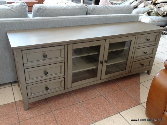 ABBYSON MEDIA CONSOLE IN GRAY. #SS-5430-1340 WITH PAPERWORK. WITH A DESIGN THAT?S CLASSIC YET