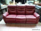 OXBLOOD RED LEATHER UPHOLSTERED POWER RECLINING 3 CUSHION SOFA. MEASURES 82 IN X 33 IN X 42 IN.