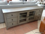 ABBYSON MEDIA CONSOLE IN GRAY. #SS-5430-1340 WITH PAPERWORK. WITH A DESIGN THAT?S CLASSIC YET