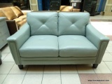 ATMORE LEATHER LOVESEAT IN BLUE. A TIMELESS SILHOUETTE WITH ADDED ELEGANCE, INTRODUCING THE ATMORE