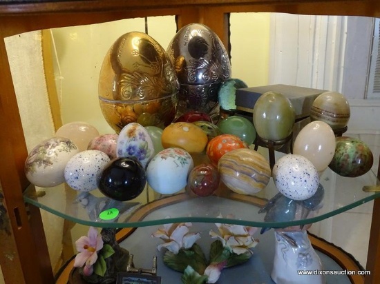 (LR) SHELF LOT OF EGGS- LOT INCLUDES ALABASTER AND CERAMIC EGGS ITEM IS SOLD AS IS WHERE IS WITH NO