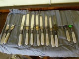 (DR) 12 SHELTON CUTLERY STERLING AND MOTHER OF PEARL HANDLED KNIVES, ITEM IS SOLD AS IS WHERE IS