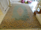 (FOYER) HANDMADE KIRMAN ORIENTAL RUG IN GREEN AND IVORY- 6' X 9', ITEM IS SOLD AS IS WHERE IS