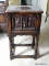 (UPBED) VINTAGE 1920'S OAK JACOBEAN STYLE STAND WITH CARVED PANEL DOOR OF CHERUB AND OWL- 16 IN X 12