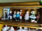 (UPBED 1) SHELF LOT OF 8 SHIRLEY TEMPLE DOLLS- 6 IN H, ITEM IS SOLD AS IS WHERE IS WITH NO