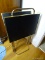 (KIT) SET OF 4 BRASS AND BLACK TV DINNER TRAYS WITH A BRASS STAND. TOTAL OF 5 PIECES. ITEM IS SOLD
