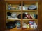 (KIT) CABINET LOT OF ASSORTED ITEMS TO INCLUDE TUPPERWARE, COFFEE MUGS, TUPPERWARE LIDS, ETC. ITEM