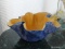 (SUN) HAND PAINTED ART POTTERY BOWL IN YELLOW AND BLUE. MEASURES 12.5