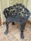 (OUT) ANTIQUE CAST IRON PATIO CHAIR. MEASURES 23 IN X 18 IN X 27 IN. ITEM IS SOLD AS IS WHERE IS