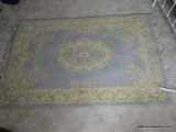 (UPBED 1) TUFTED CHINESE RUG IN IVORY AND BLUE- 4 FT. X 6 FT., ITEM IS SOLD AS IS WHERE IS WITH NO