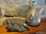 (FAM) CARVED STONE STATUE OF MAN LAYING DOWN- 11 IN AND ART POTTERY VASE- 13 IN H, ITEM IS SOLD AS