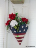 (SUN) PAIR OF AMERICAN FLAG THEMED WALL POCKETS WITH ARTIFICIAL FLOWERS. ITEM IS SOLD AS IS WHERE IS