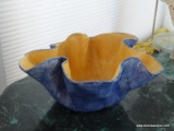 (SUN) HAND PAINTED ART POTTERY BOWL IN YELLOW AND BLUE. MEASURES 12.5