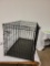 LARGE DOG CRATE. MEASURES APPROX. 28IN H X 41.5IN L X 25IN W. ITEM IS SOLD AS IS WHERE IS WITH NO