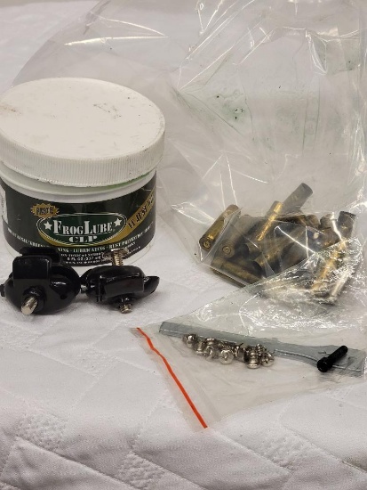 FROGLUBE CLP PASTE, EMPTY BRASS SHELLS AND FIREARM ACCESSORIES. ITEM IS SOLD AS IS WHERE IS WITH NO
