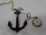 BULL'S EYE WESTCLOX POCKET WATCH AND SMALL WALL ART BOAT ANCHOR. ITEM IS SOLD AS IS WHERE IS WITH NO