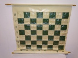 WALL CHESS/CHECKERS GREEN AND WHITE BOARD. MEASURES 26.5 IN W X 32 IN L. ITEM IS SOLD AS IS WHERE IS