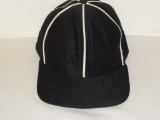 NEW ERA PRO MODEL BLACK AND WHITE BASEBALL CAP SIZE 7 3/8. ITEM IS SOLD AS IS WHERE IS WITH NO
