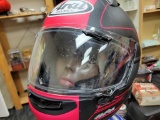 ARAI MOTORCYLE HELMET. A FEW SCRATCHES. SIZE L.MANNEQUIN NOT INCLUDED. ITEM IS SOLD AS IS WHERE IS