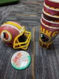 REDSKINS PLASTIC CUPS, HELMET AND BUTTON. ITEM IS SOLD AS IS WHERE IS WITH NO GUARANTEES OR