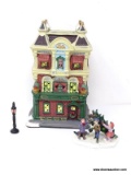 HOLIDAY VILLAGE BUILDING OF A HOTEL WITH 2 EXTRA FIGURINES (1 OF A LAMP POST AND 1 OF CHILDREN