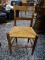 (R1) OAK MULE EARRED AND RUSH BOTTOM CHAIR. MEASURES 18 IN X 18 IN X 34 IN. ITEM IS SOLD AS IS WHERE