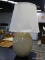 (R1) STONE FINISH TABLE LAMP WITH CLOTH SHADE AND SILVER TONE FINIAL. MEASURES 23 IN TALL. ITEM IS