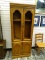 (R1) OAK 2 SHELF CABINET WITH 2 UPPER DOORS AND 2 LOWER WOOD PANELED DOORS. HAS DENTIL MOLDING TOP