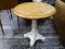 (R1) MAPLE AND CREAM PAINTED PEDESTAL BASE END TABLE. MEASURES 27 IN X 28 IN. ITEM IS SOLD AS IS,