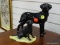 (R2) PAIR OF BLACK LABRADOR FIGURINES (1 IS MADE IN SCOTLAND AND 1 IS MADE IN ENGLAND). ITEM IS SOLD