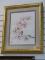 (R1) FRAMED AND TRIPLE MATTED CHERRY BLOSSOM PRINT IN A GOLD TONE FRAME. IS SIGNED V.C.C. MEASURES