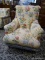 (R2) YELLOW UPHOLSTERED ARM CHAIR WITH POTTED FLOWER PATTERN. IS 1 OF A PAIR. MEASURES 32 IN X 34 IN